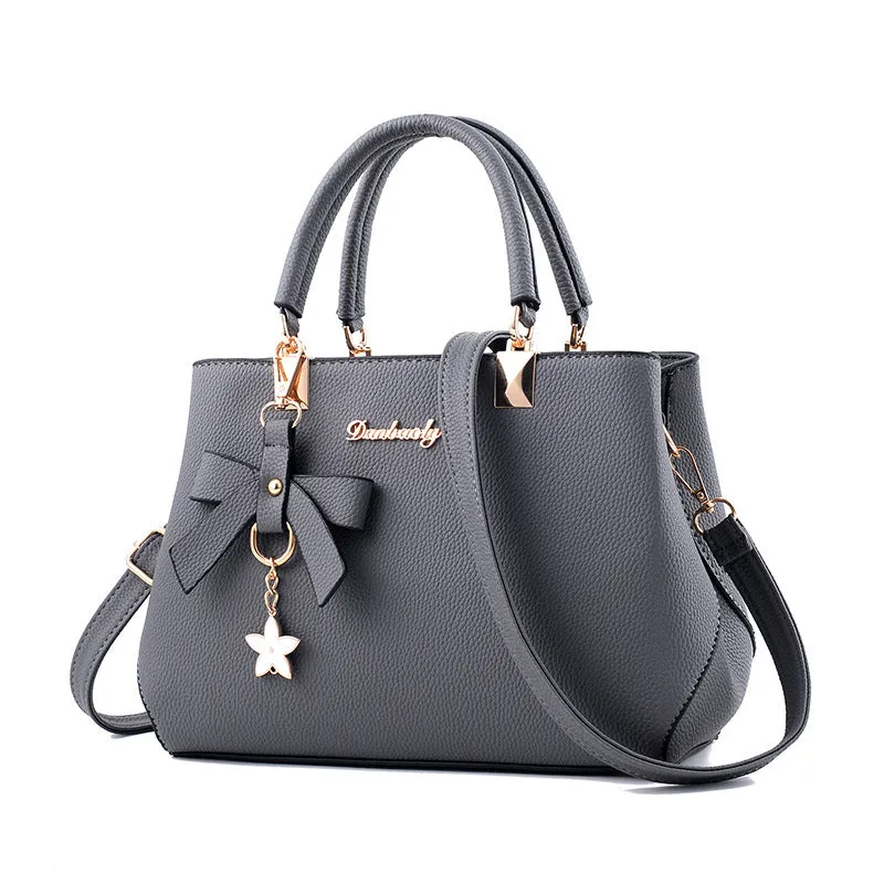 Michelle  Schultertasche mit Schleifenstern-Anhnger